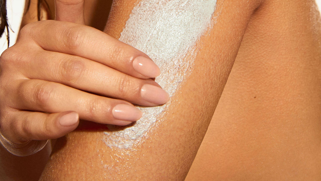 Woman with Keratosis Pilaris using KP Body Scrub on arm.