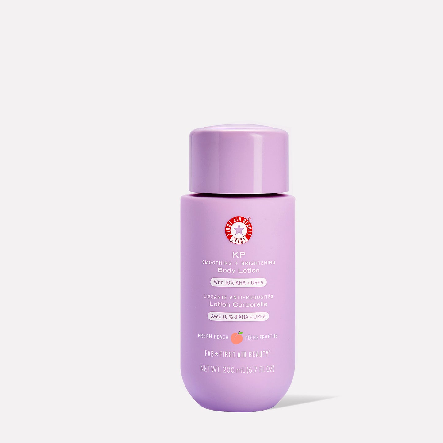 A lavender bottle displays "KP Smoothing + Brightening Body Lotion" by First Aid Beauty, featuring text including "With 10% AHA + Urea", "Fresh Peach", and "NET WT. 200 mL (6.7 FL OZ)".