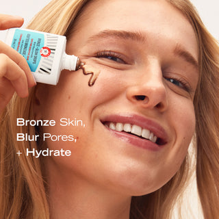 Model using Bronze + Glow Drops. Bronze Skin, Blur Pores, + Hydrate.