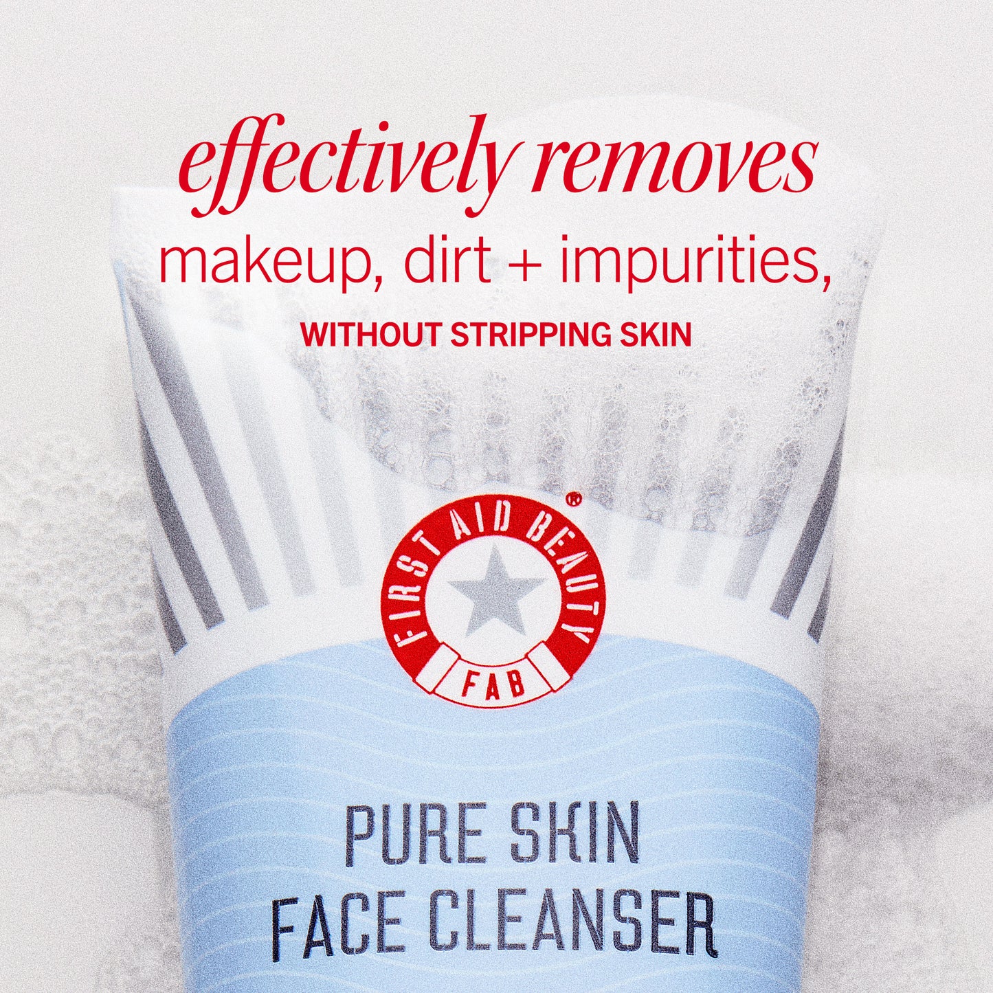 A tube of "First Aid Beauty Pure Skin Face Cleanser" displays text: "effectively removes makeup, dirt + impurities, WITHOUT STRIPPING SKIN." The tube is surrounded by a textured, fuzzy surface.