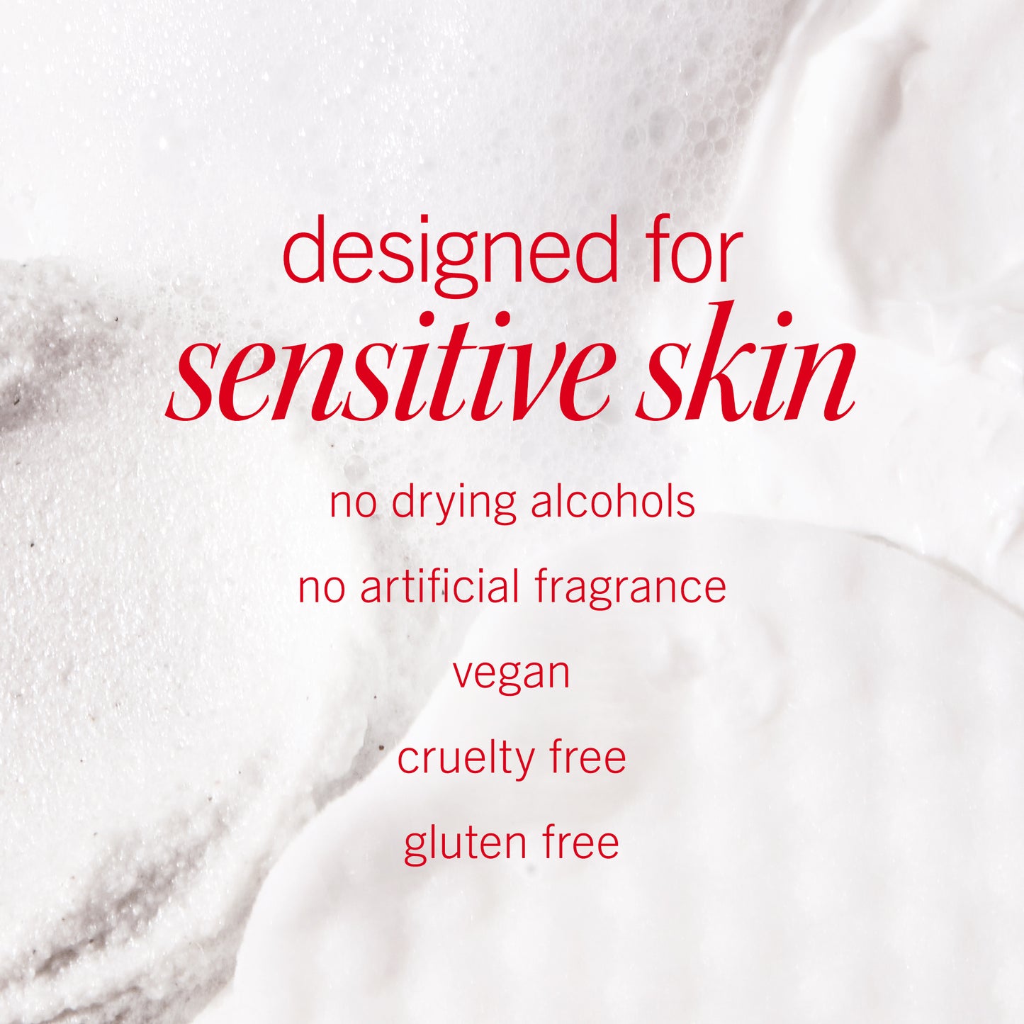 Foamy white texture fills the background, overlaid with red text stating: "designed for sensitive skin, no drying alcohols, no artificial fragrance, vegan, cruelty free, gluten free.