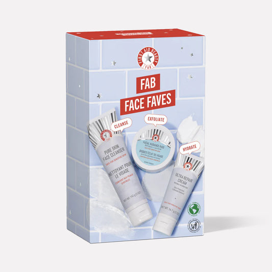 A skincare gift set box titled "FAB Face Faves" contains three products: Pure Skin Face Cleanser, Facial Radiance Pads, and Ultra Repair Cream. The design features a tiled background with small star accents.