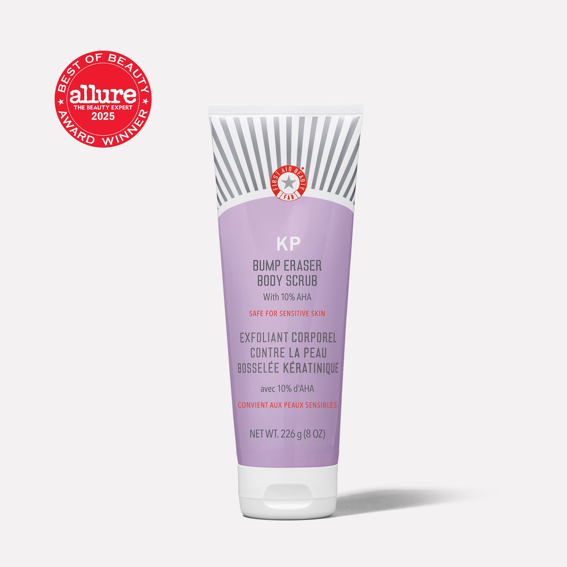 A tube labeled “KP Bump Eraser Body Scrub with 10% AHA,” designed for sensitive skin, stands on a plain background. Features an “Allure Best of Beauty Award Winner 2025” badge. Net weight: 226g (8 oz).