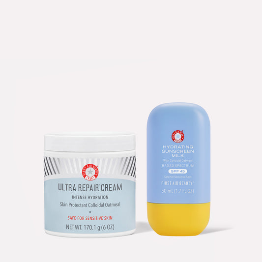 Container of "Ultra Repair Cream," intense hydration formula with colloidal oatmeal for sensitive skin, beside a bottle of "Hydrating Sunscreen Milk" SPF 45. Both are by First Aid Beauty.