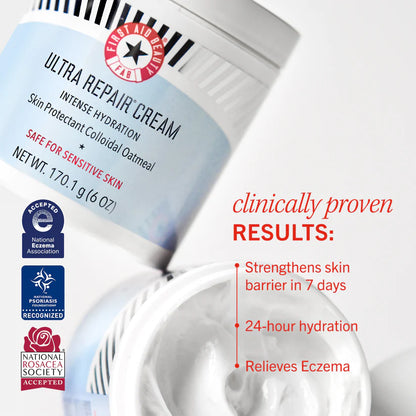 A jar of "First Aid Beauty Ultra Repair Cream" for sensitive skin stands open, displaying its contents. The cream is recognized by skincare associations. Text highlights benefits: strengthens skin barrier, 24-hour hydration, relieves eczema.