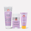 Three skincare products with purple packaging stand upright against a white background. Text includes: "KP Bump Eraser Body Scrub," "Anti-Chafe Stick," and "Whole Body Deodorant Cream." Each product is labeled safe for sensitive skin.
